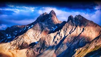 Dramatic Mountain Peaks Under a Dynamic Sky