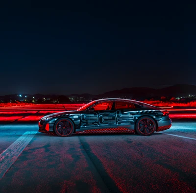 Prototipo Audi RS e-tron GT con diseño futurista bajo el cielo nocturno