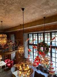 Elegant Dining Room with Artistic Lighting and Festive Decor