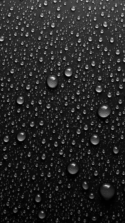 Surface noire abstraite avec des gouttes d'eau