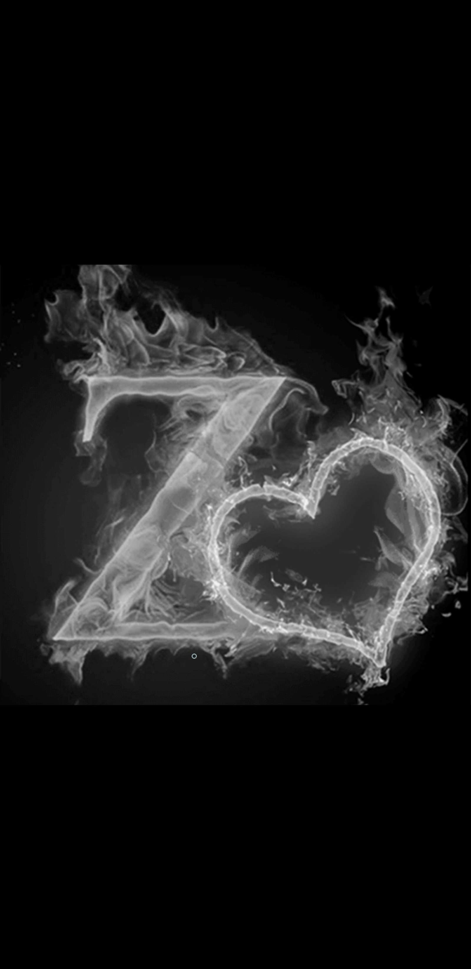 A black and white photo of a heart shaped fire in the shape of a z (smoke, black, letter, alphabets, letters)