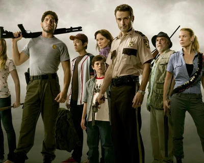 Main characters from "The Walking Dead" standing united, ready to face the challenges of a post-apocalyptic world.