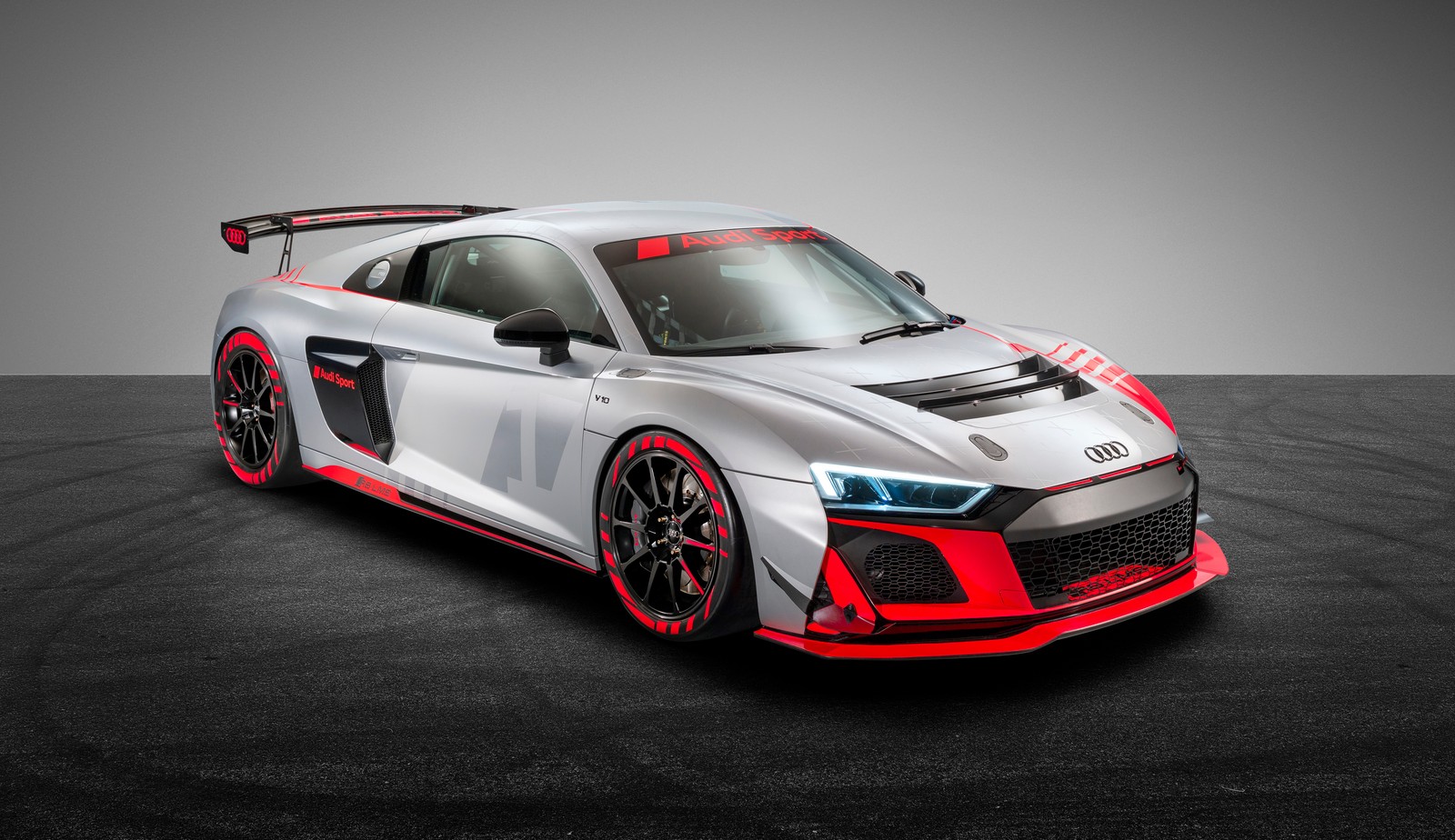 The audi r8 race car is shown in a studio (audi r8 lms gt4, 5k, cars, 4k wallpaper)