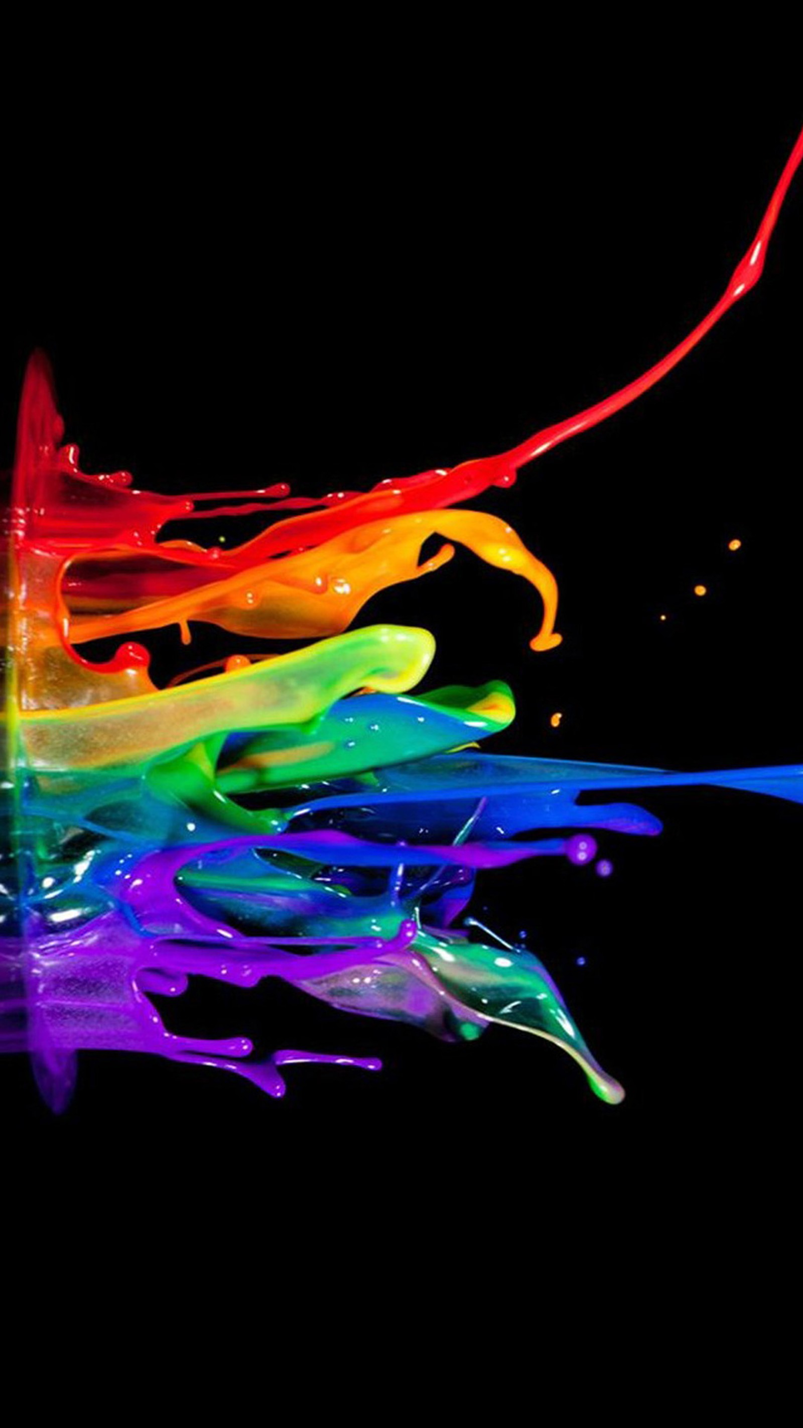 Brightly colored paint pouring down a black surface (abstract, colorful, paint)