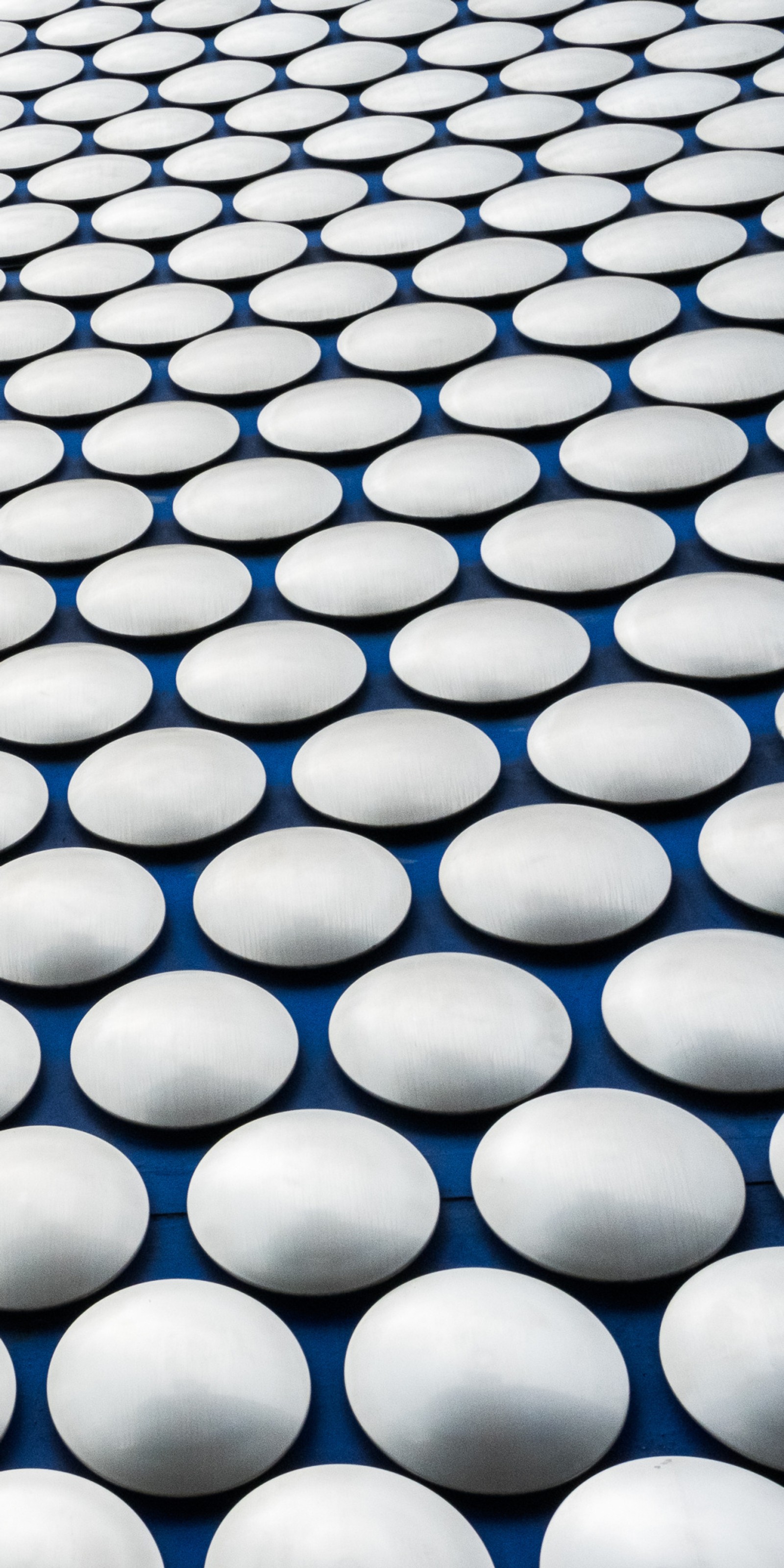 Arafed image of a large number of white circles on a blue surface (abstract, android, background, buttons, hq)