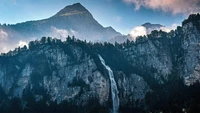 Majestic Reichenbach Falls Surrounded by Swiss Mountains