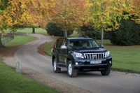 Toyota Land Cruiser Prado Driving Through Autumn Landscape