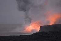 Lava erupts from a shield volcano, illuminating the dark sky with fiery sparks against a backdrop of smoke and rocky terrain.