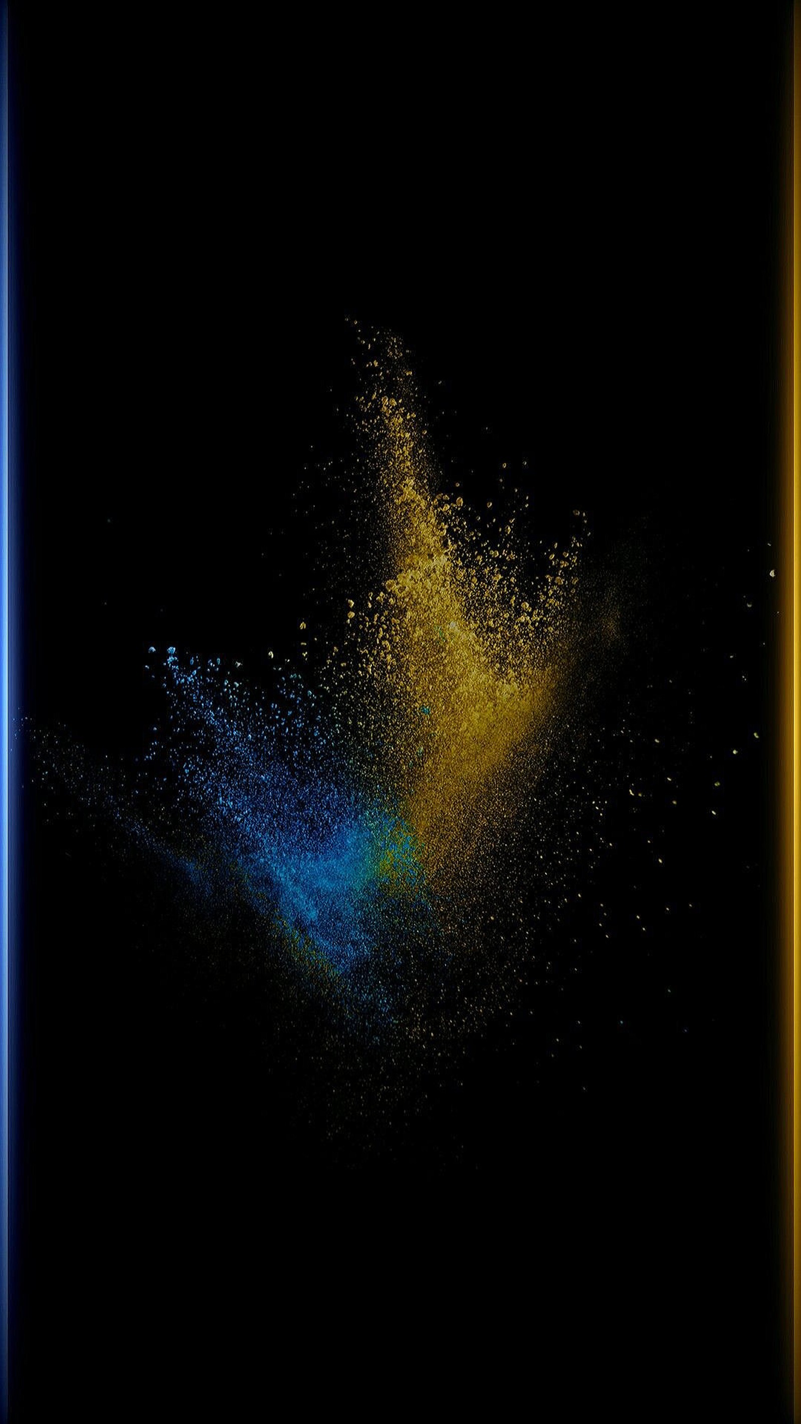 Arafed image of a blue and yellow powder explosion in the dark (black, dust, edge, explosion)