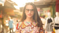 Vibrant Street Fashion with Sunglasses and Stylish Hairstyle