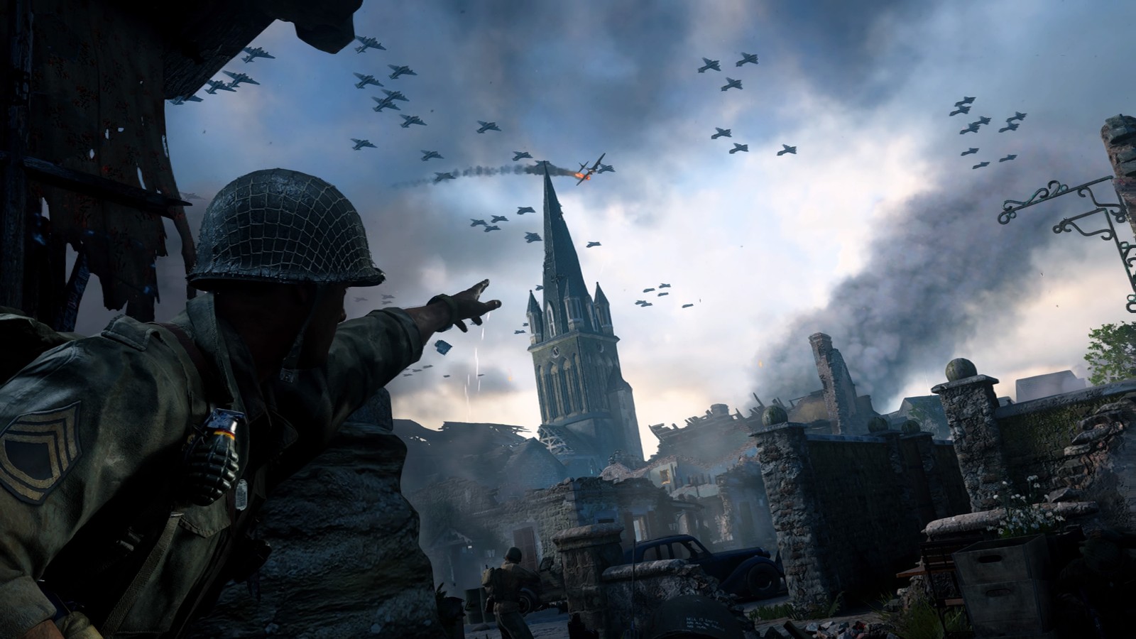 A close up of a soldier pointing at a building with a tower in the background (call of duty wwii, call of duty zombies, pc game, games, soldier)