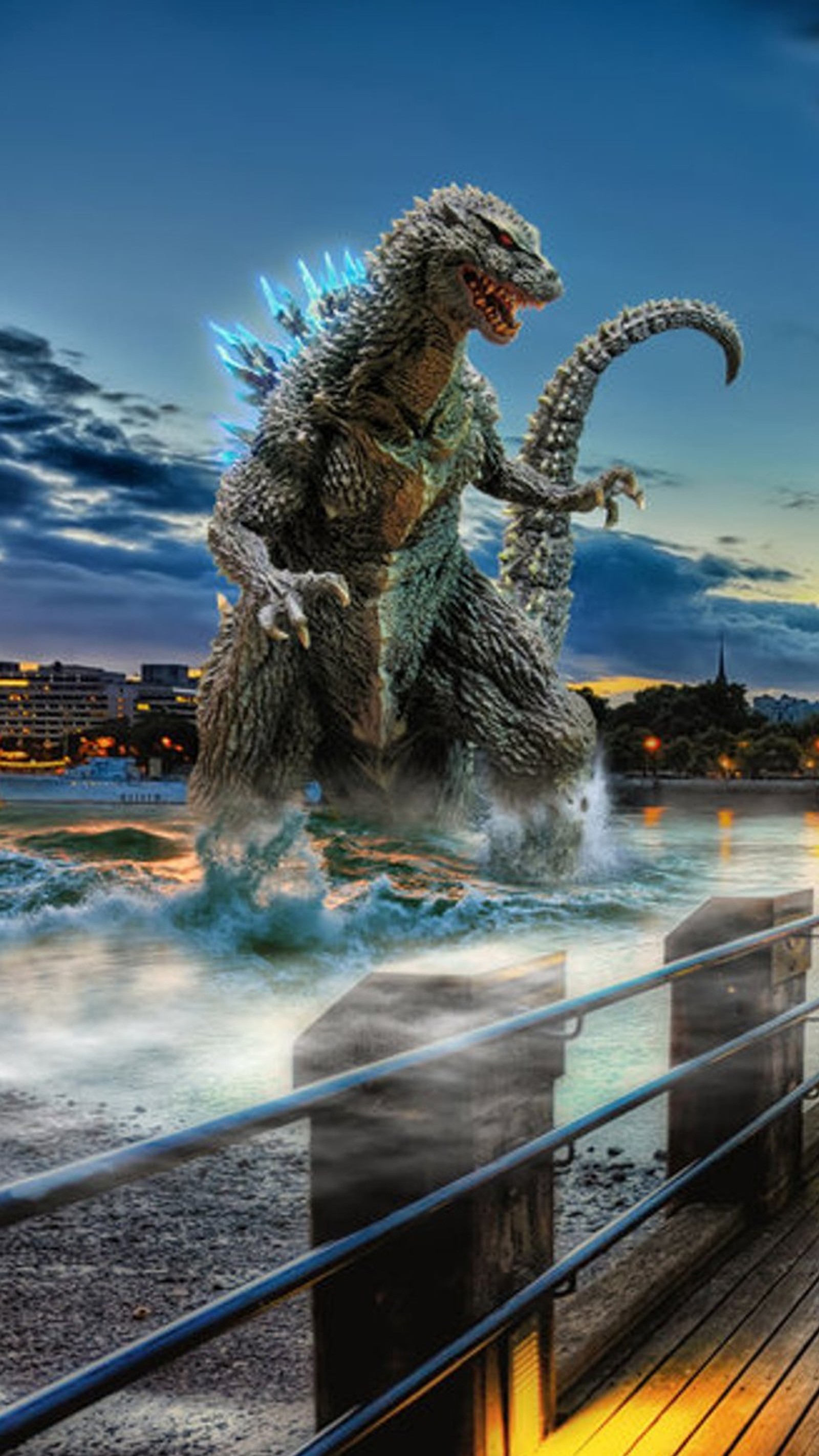 Estatua de godzilla en un muelle con vista al agua por la noche (mejor, godzilla, película, mundo)