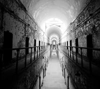 Desolate Black-and-White Prison Corridor