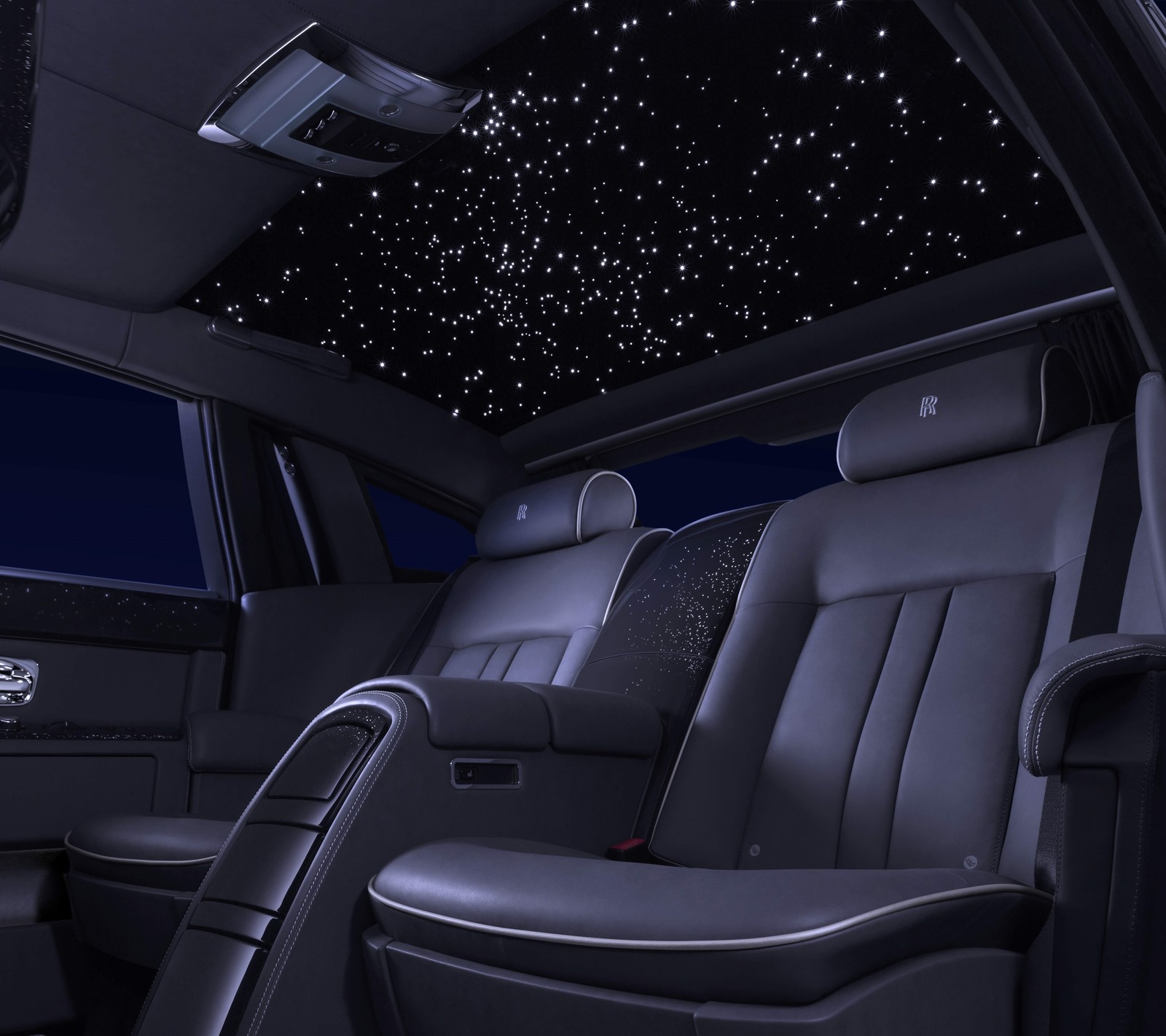 A close up of a car with a star ceiling and a car seat (auto, car, interior, phantom, rolls)