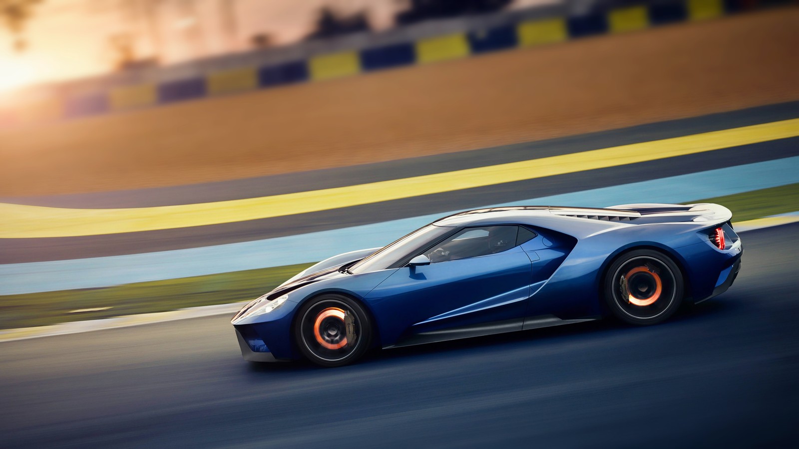 A blue sports car driving on a track with a sunset in the background (ford gt, car, sports car, ford, supercar)