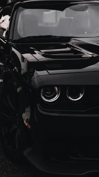 Sleek Black Dodge Sports Car with Striking Headlamps