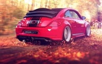 2012 Volkswagen New Beetle Convertible in Red on a Scenic Autumn Road