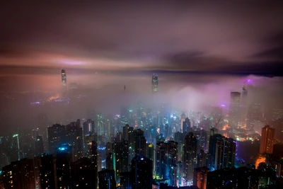 Mesmerizing Hong Kong Skyline at Night: A City Enveloped in Mist and Lights