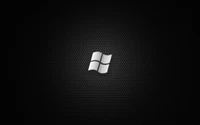 Logotipo monocromático estilizado de Windows sobre un fondo negro texturizado.