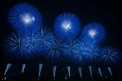 Stunning Blue Fireworks Display Illuminating the Night Sky on New Year's Eve