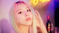 Chaeyoung from TWICE with vibrant hair and a captivating gaze, set against a colorful backdrop, embodying the essence of the "Taste of Love" album.