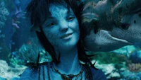 Kiri from "Avatar: The Way of Water" in an underwater scene with marine life.