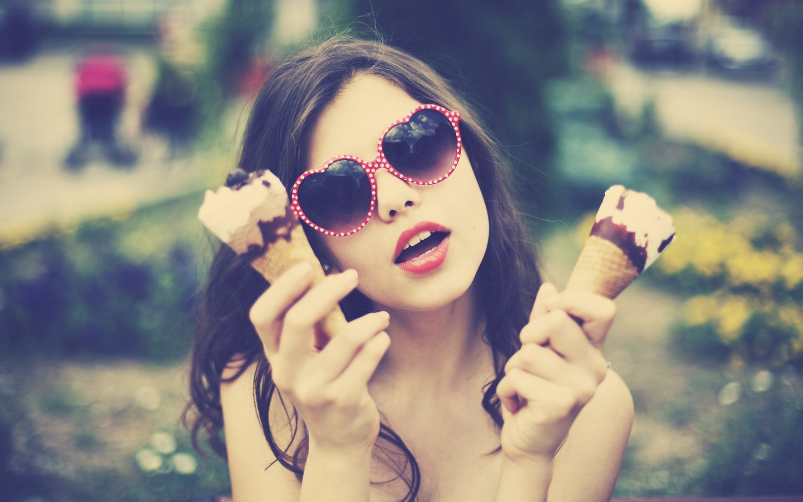 There is a woman wearing sunglasses and eating ice cream cones (beauty, aviator sunglasses, girl, lips, purple)