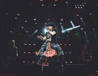 Axl Rose electrifies the stage during the "Not in This Lifetime" tour, showcasing a powerful hard rock performance in Los Angeles.