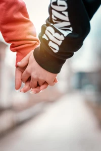 Couple Holding Hands in a Tender Gesture of Love