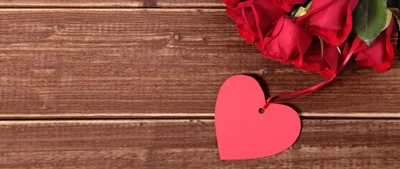 Romantic Red Roses and Heart Tag on Stained Wood Floor