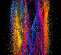 Vibrant Explosion of Colorful Particles on Black Background