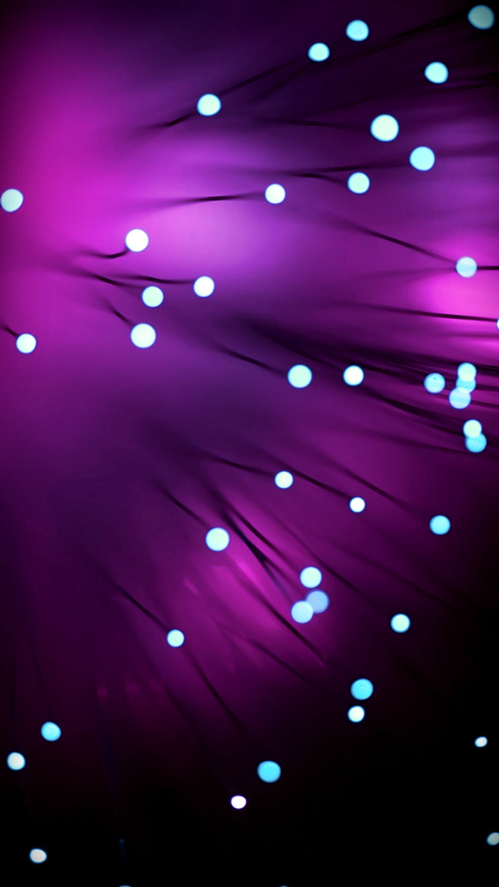 A close up of a bunch of lights on a black background (abstract, bubbles, purple)