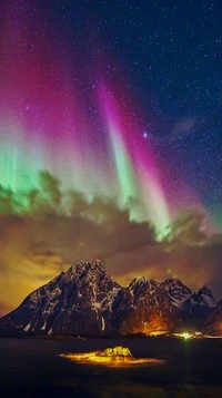 Majestic Aurora Over Snow-Capped Mountains