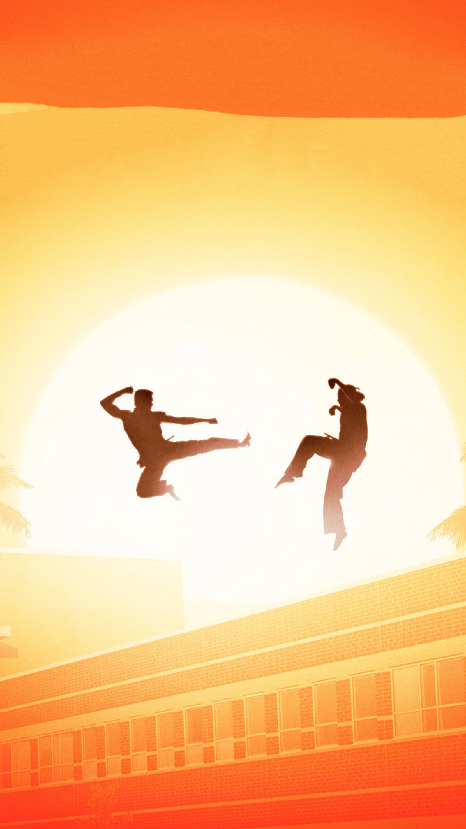 There are two people doing a trick on a roof at sunset (cobra kai, karate kid)