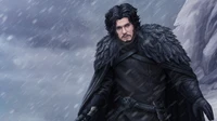 Jon Snow in dark, fur-lined outerwear, standing against a snowy backdrop, exuding a sense of determination and strength.