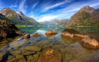 Tranquil Fjord Reflection Surrounded by Majestic Mountains and Colorful Rocks