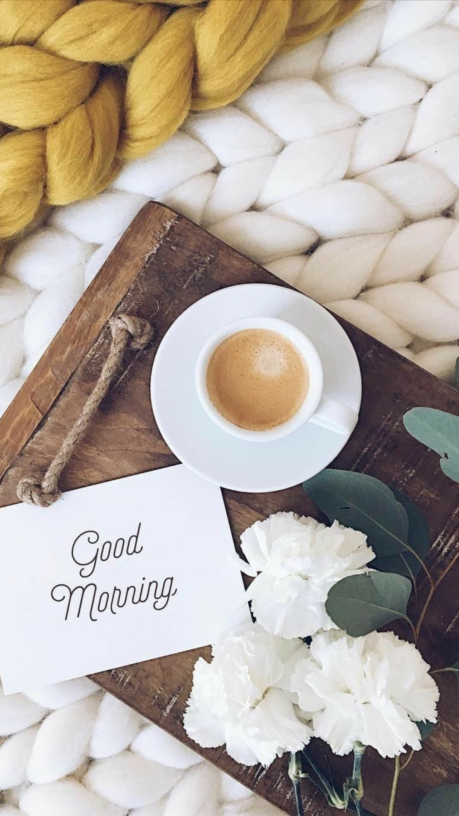 There is a cup of coffee and a card on a wooden tray (breakfast, coffee, flowers, good, good morning)