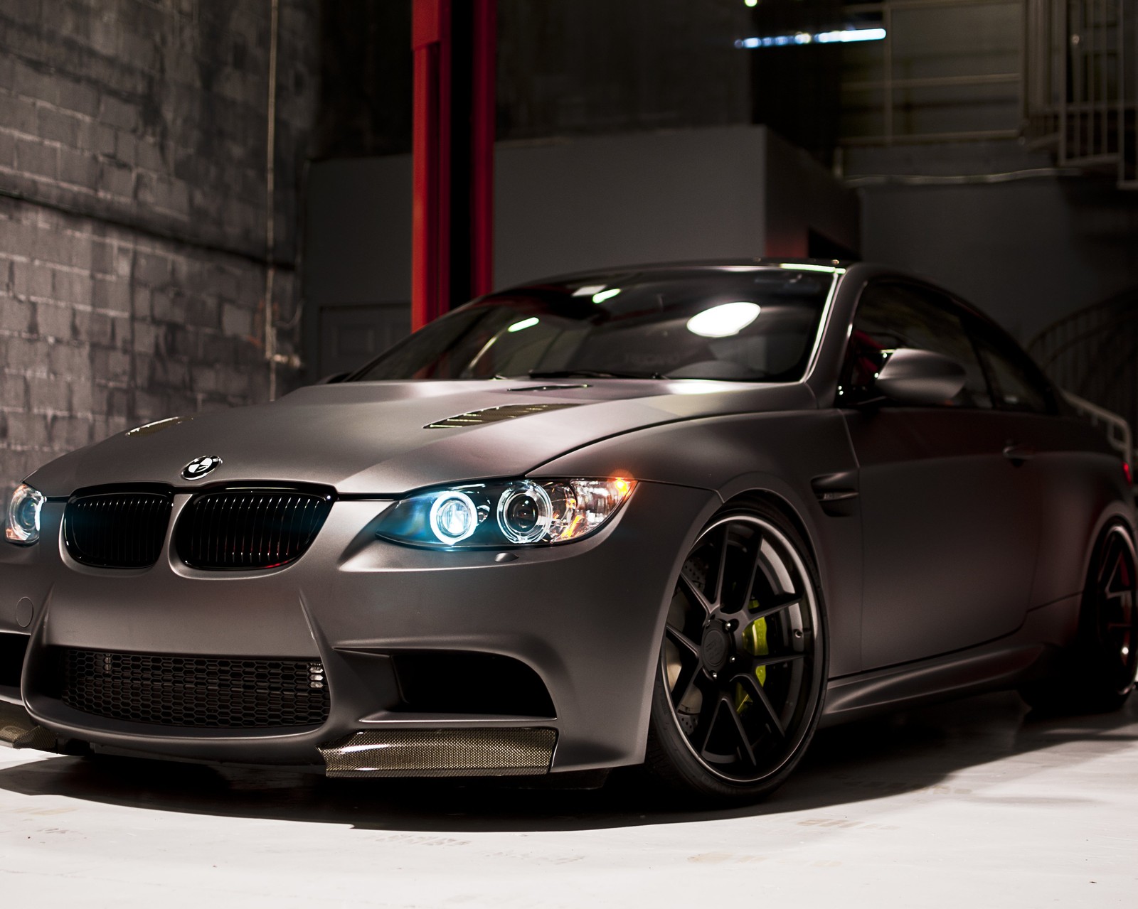 Arafed bmw car parked in a garage with a brick wall (bmw, car, german)