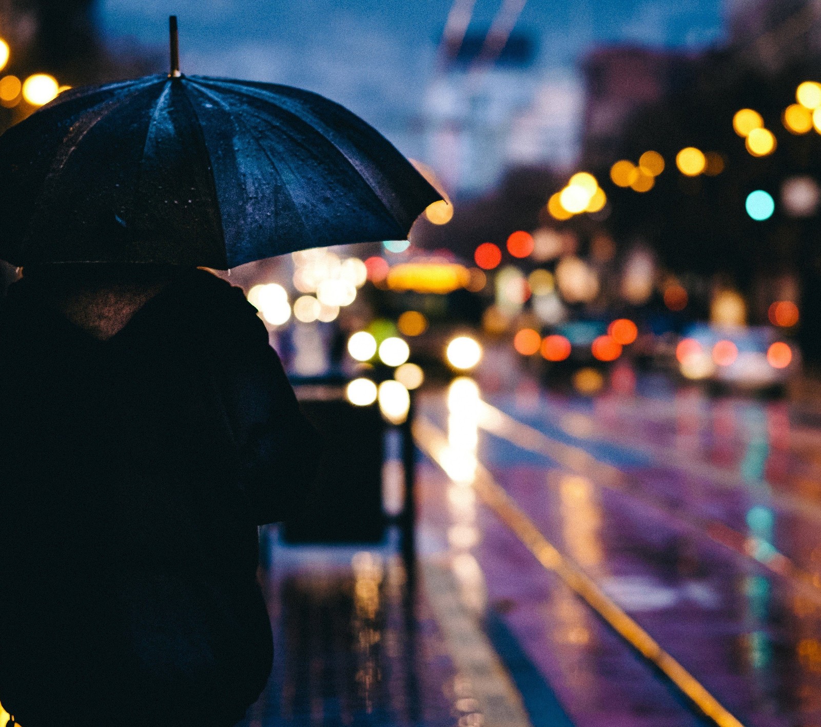 Araffe walking in the rain with an umbrella in the city (city, rain, umbrella)