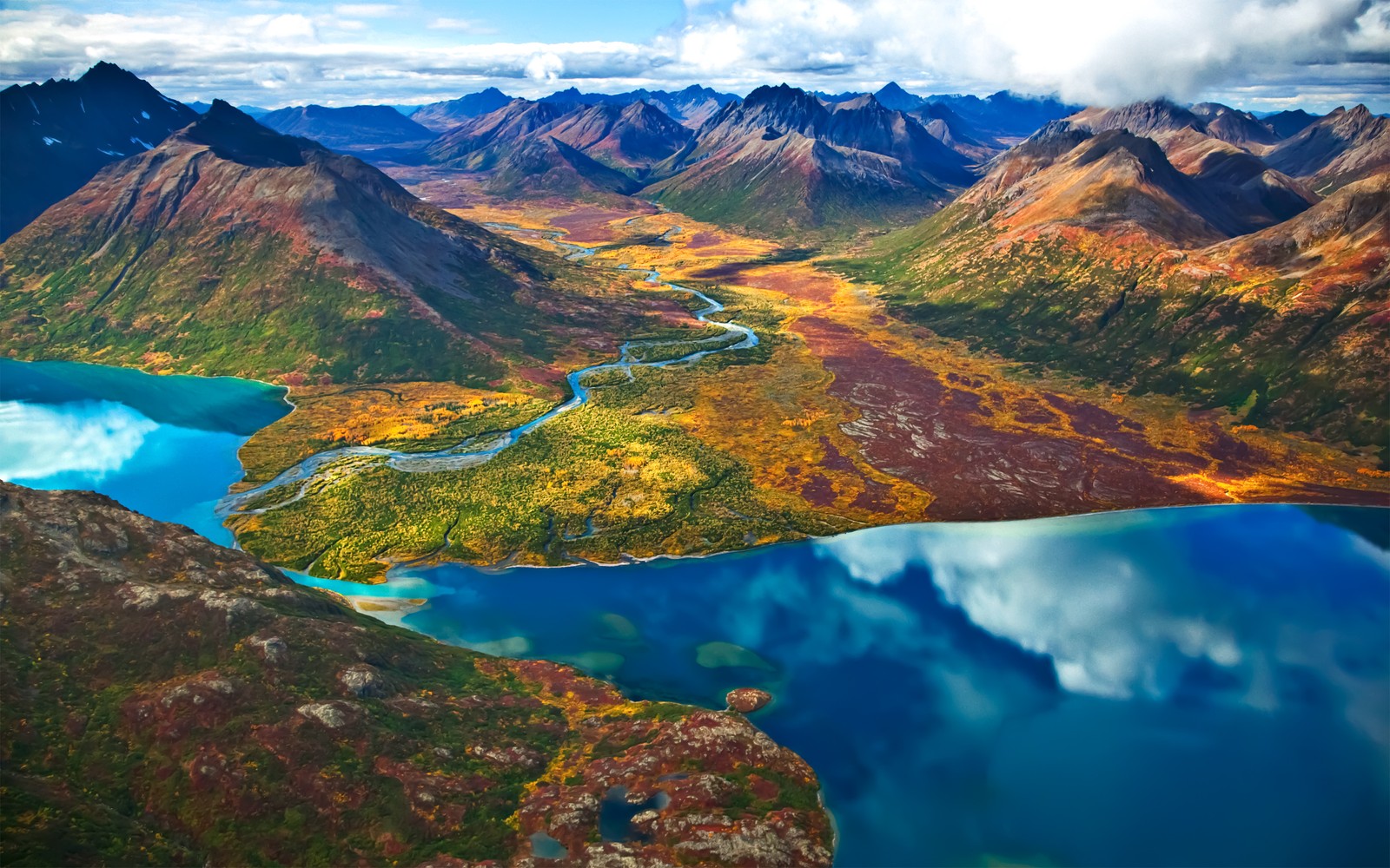 A view of a lake surrounded by mountains and a valley (landscape, mountains, river, sunny day, scenery)