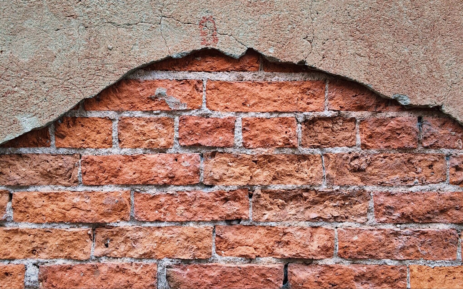 A close up of a brick wall with a hole in it (brickwork, brick, wall, stone wall, texture)