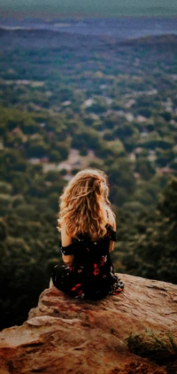 Blonde Girl Contemplating Life on a Cliffside at Dusk