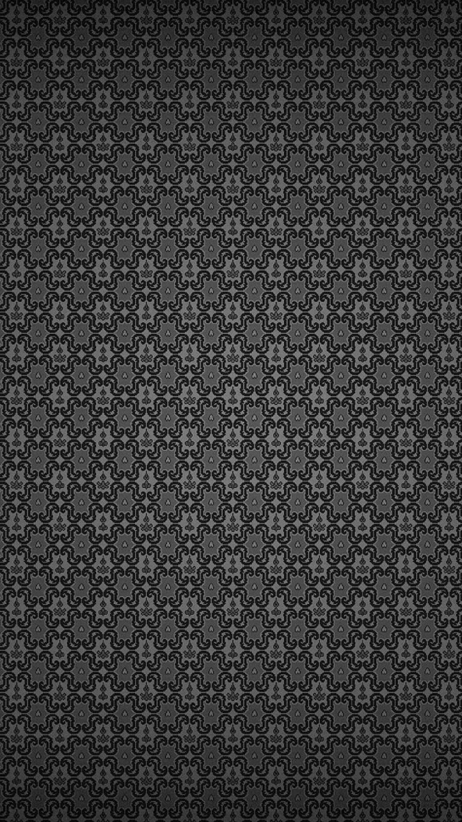 A black and white wallpaper with a pattern of flowers (black, color)