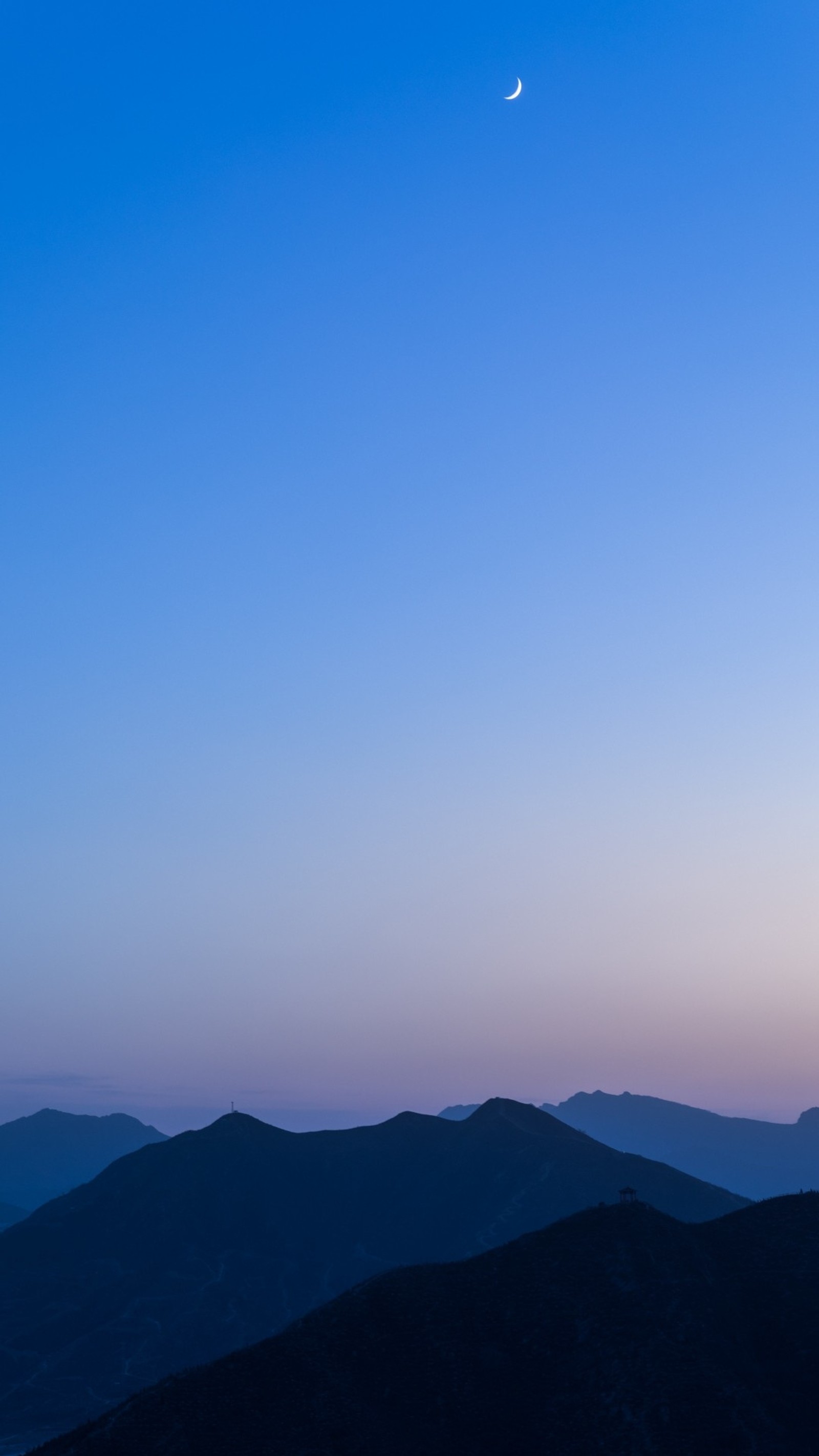 Arafed view of a moon setting over a mountain range (blue, cold, edge, mountain, mountains)