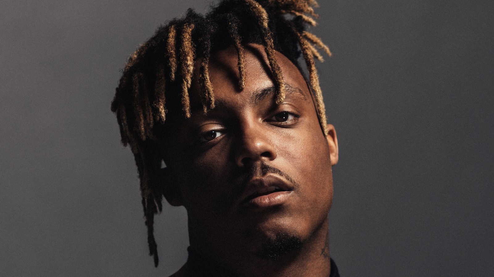 A close up of a man with dreadlocks on his head (juice wrld, american rapper, american singer, music, 4k wallpaper)