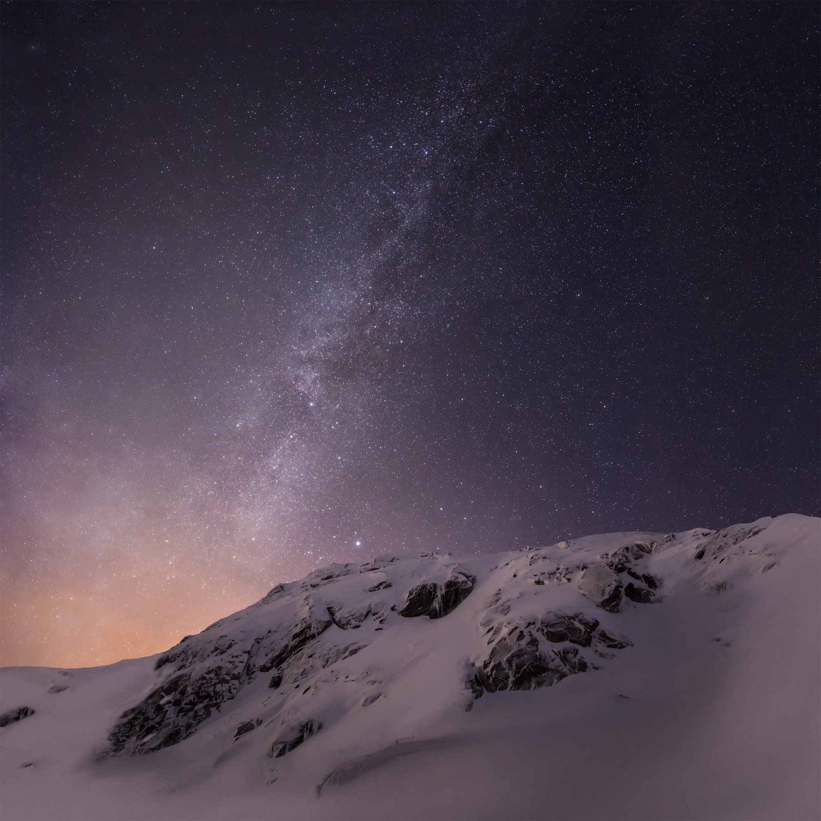 Starry sky over a snowy mountain with a few snow covered rocks (ios 8, ios, apples, atmosphere, natural environment)