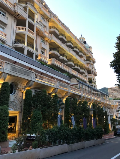 Classical Architecture with Lush Shrubs and Elegant Balconies