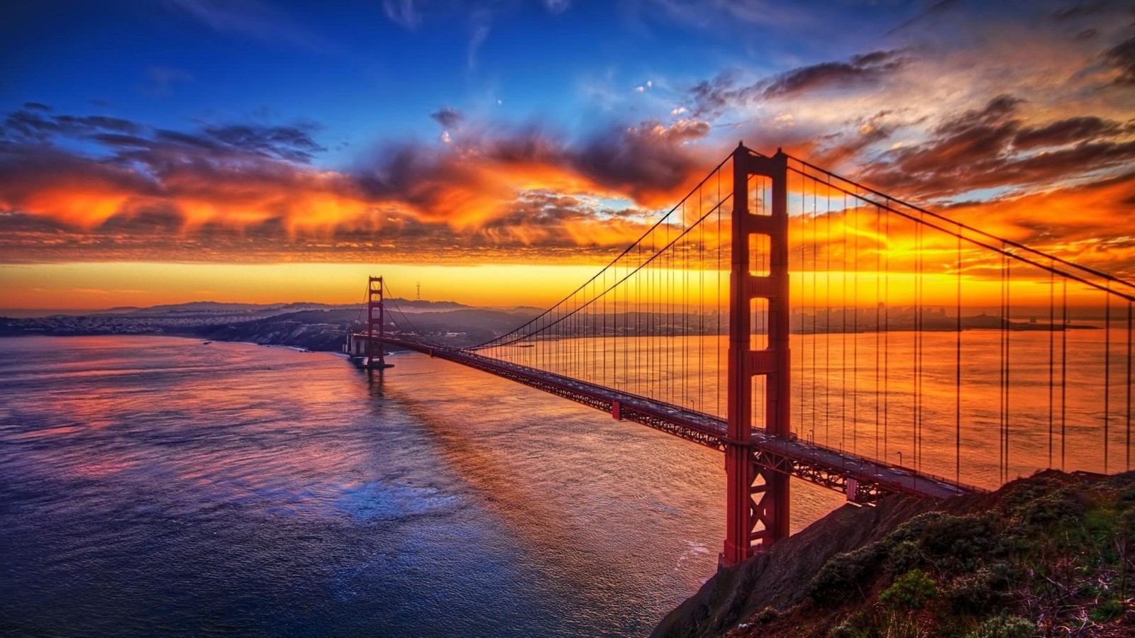 A view of the golden gate bridge at sunset from the top of a hill (golden gate bridge, sunset, bridge, horizon, morning)