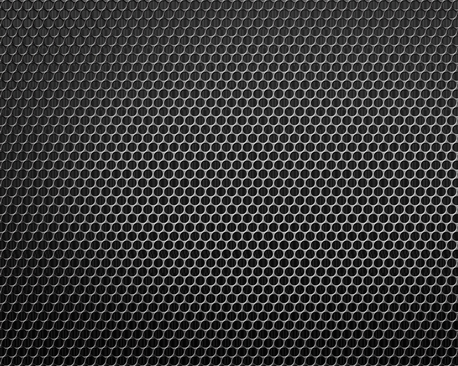 A black metal background with a lot of holes (abstract, metal, pattern)