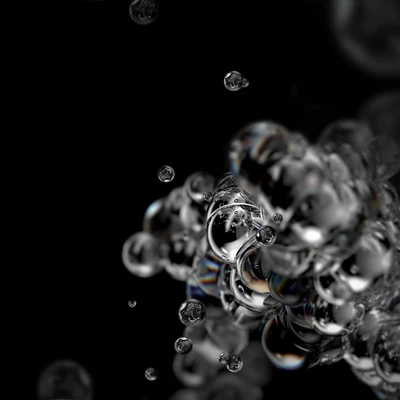 Photographie macro de bulles dans un liquide sur fond noir